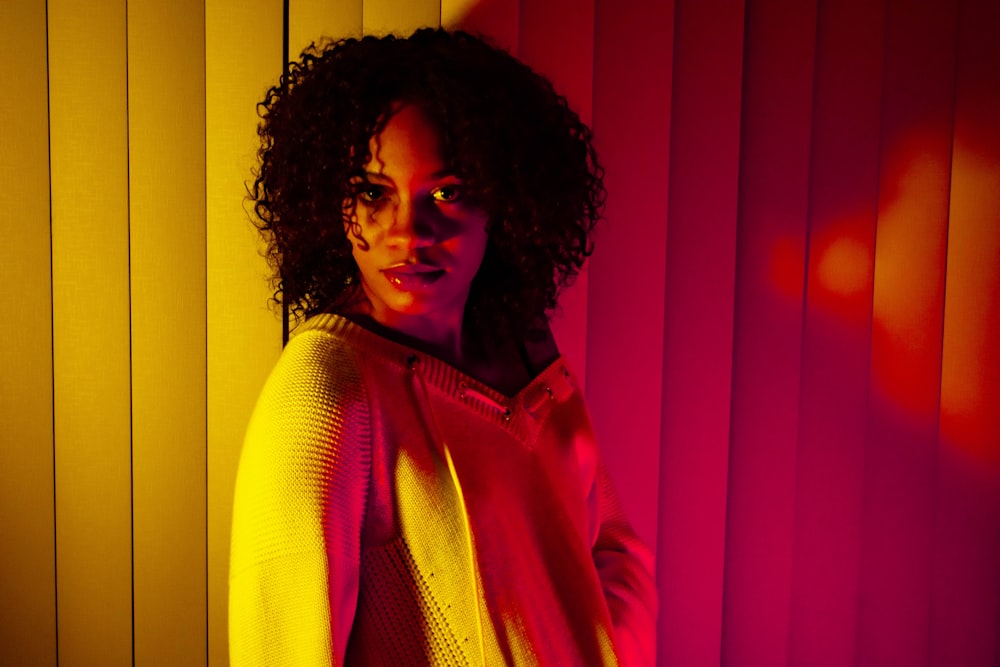 woman leaning on blinds