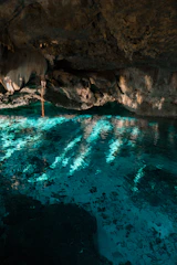 body of water under cave