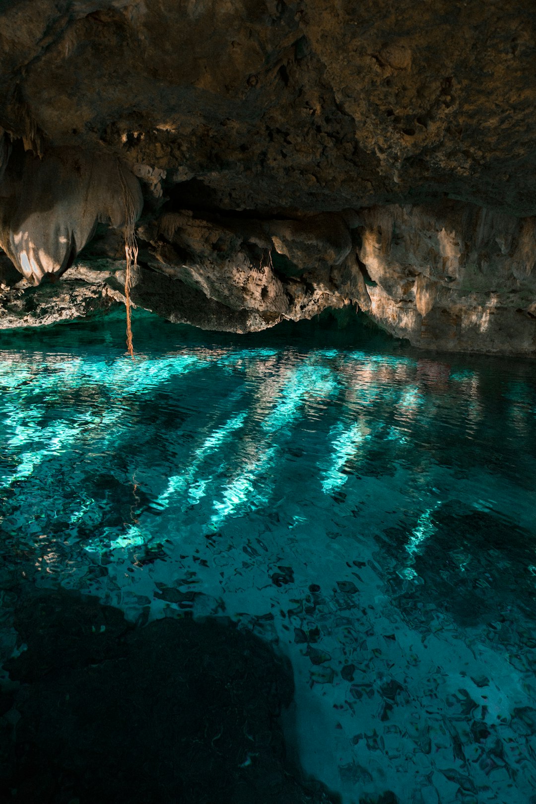 body of water under cave