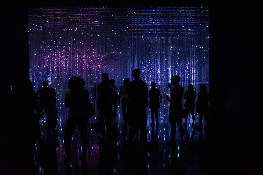 silhouette of people inside a dark room