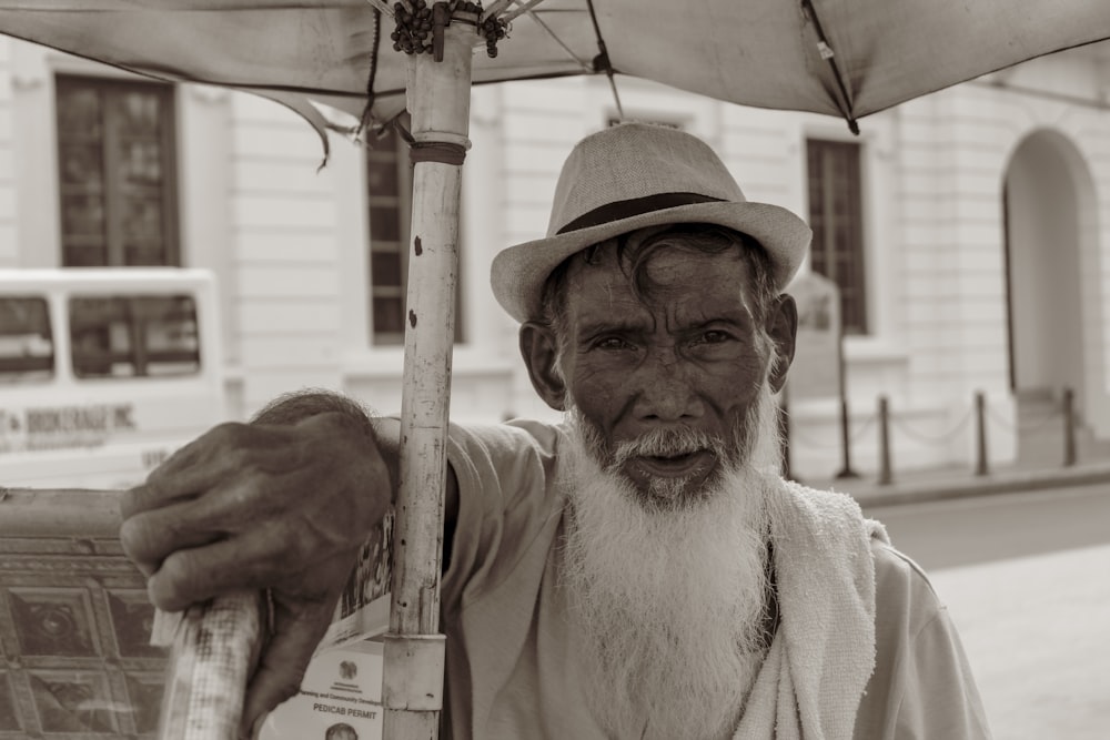 grayscale photo of man wearing hat