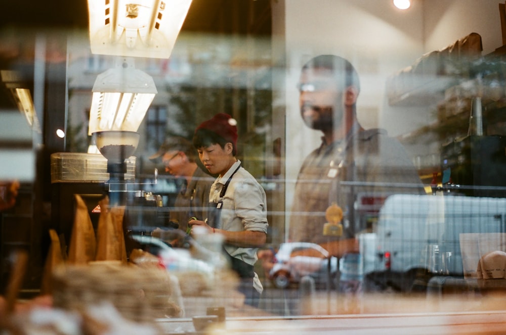 people inside a glass windowed room