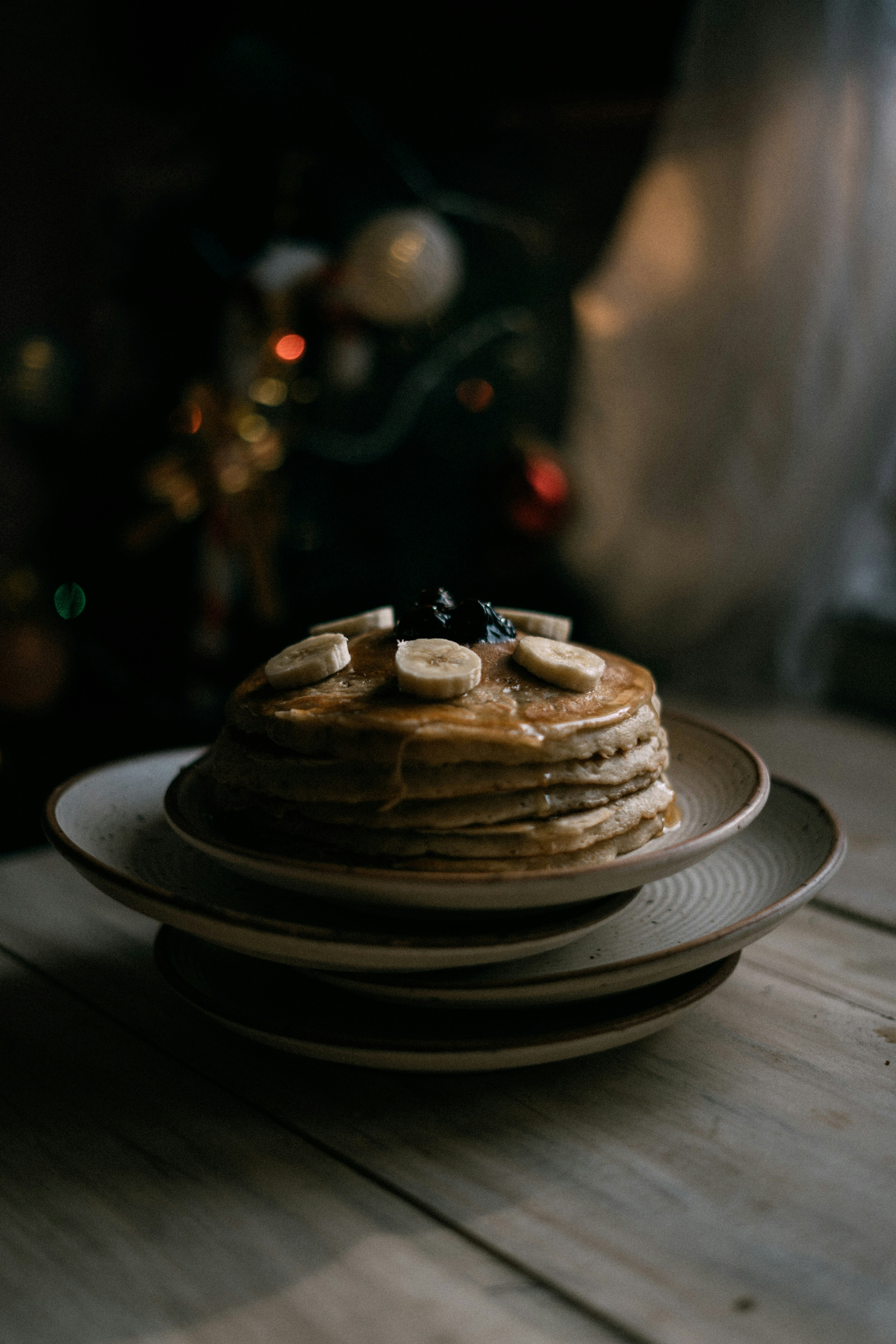 pancake on white ceramic saucer on table