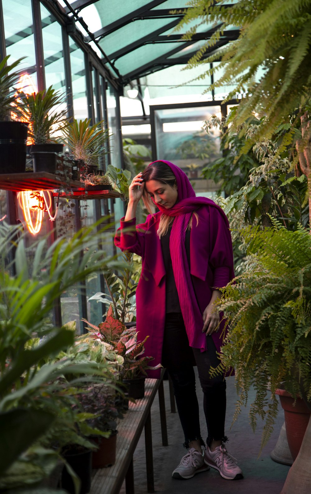 woman standing inside plant builidng