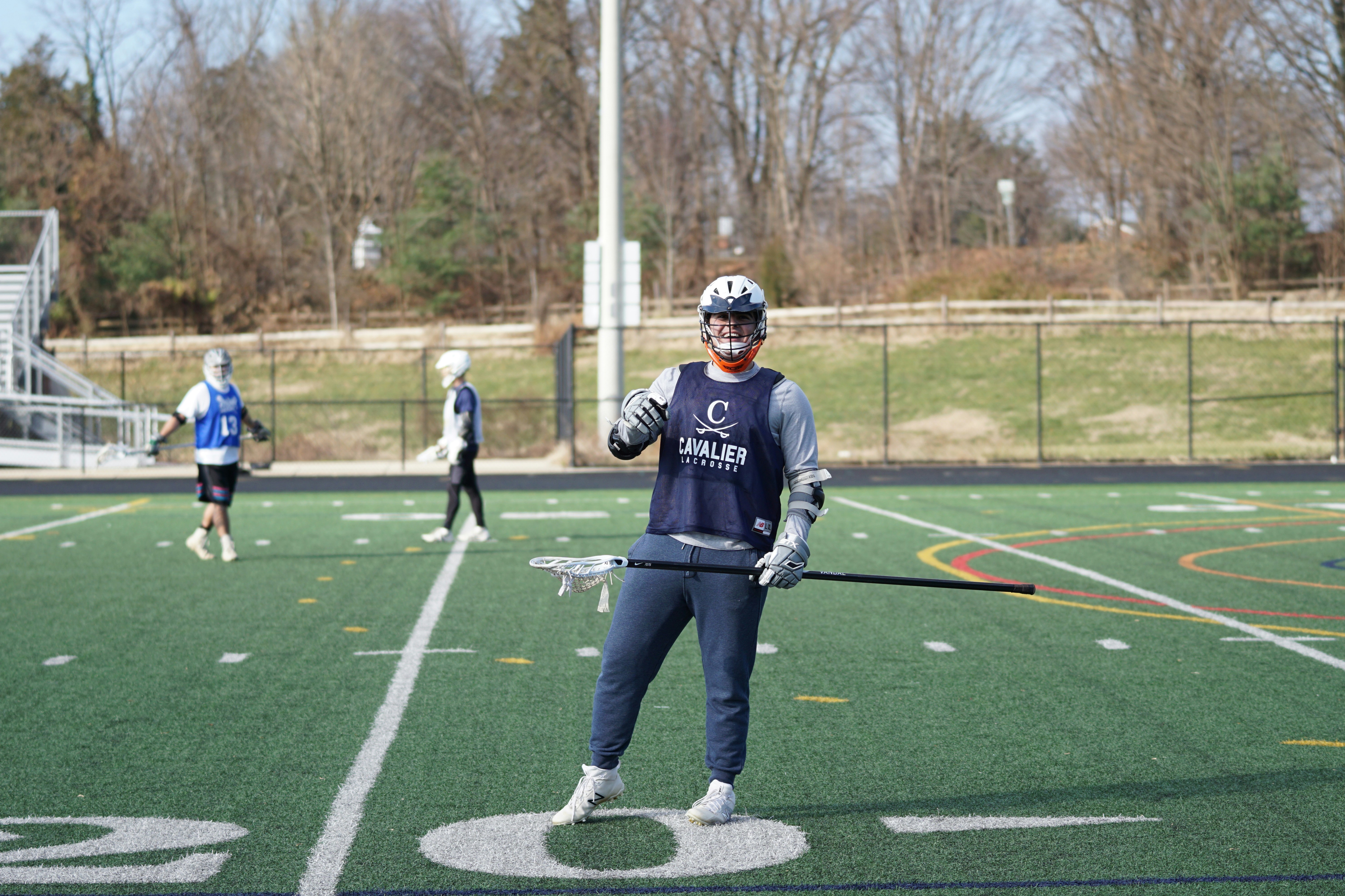 Man holding lacrosse stick photo Free Human Image on Unsplash