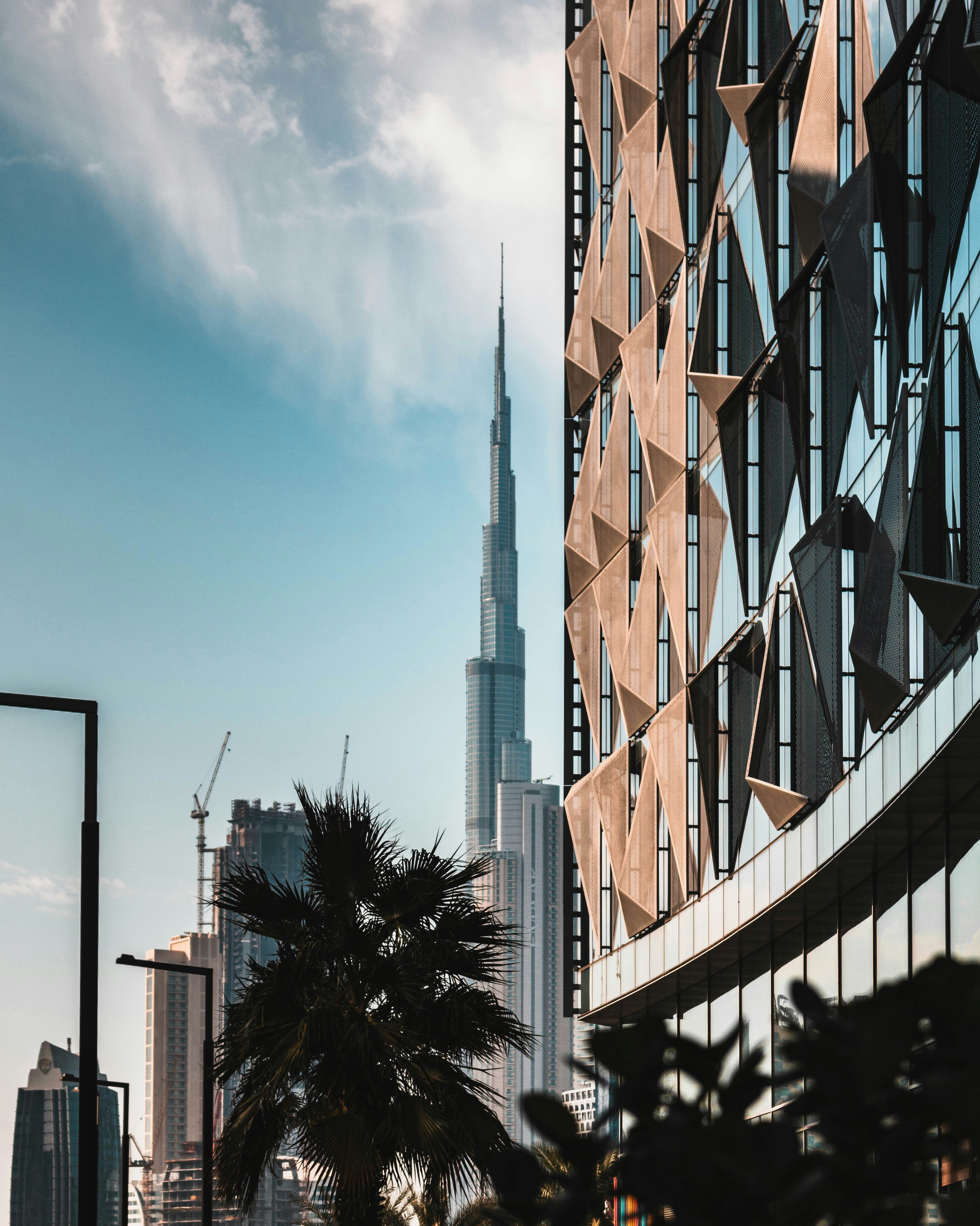 white clouds over city with high rise buildings