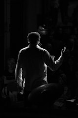 grayscale of man in dress shirt