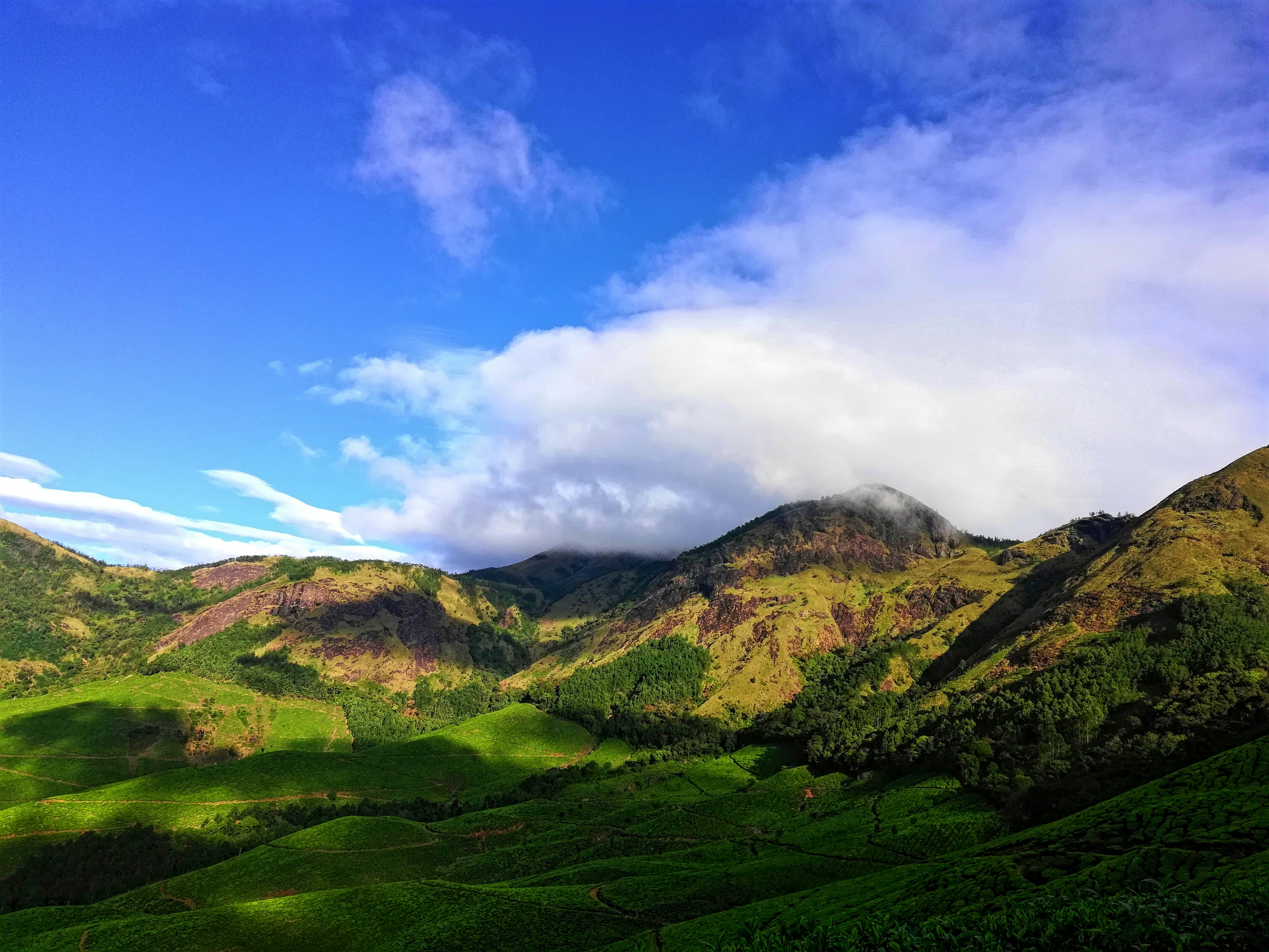green mountain hill under blue sky, 