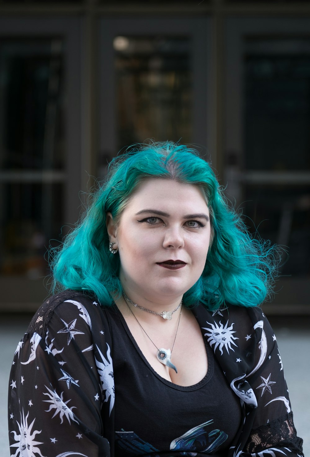 woman wearing black and white floral top