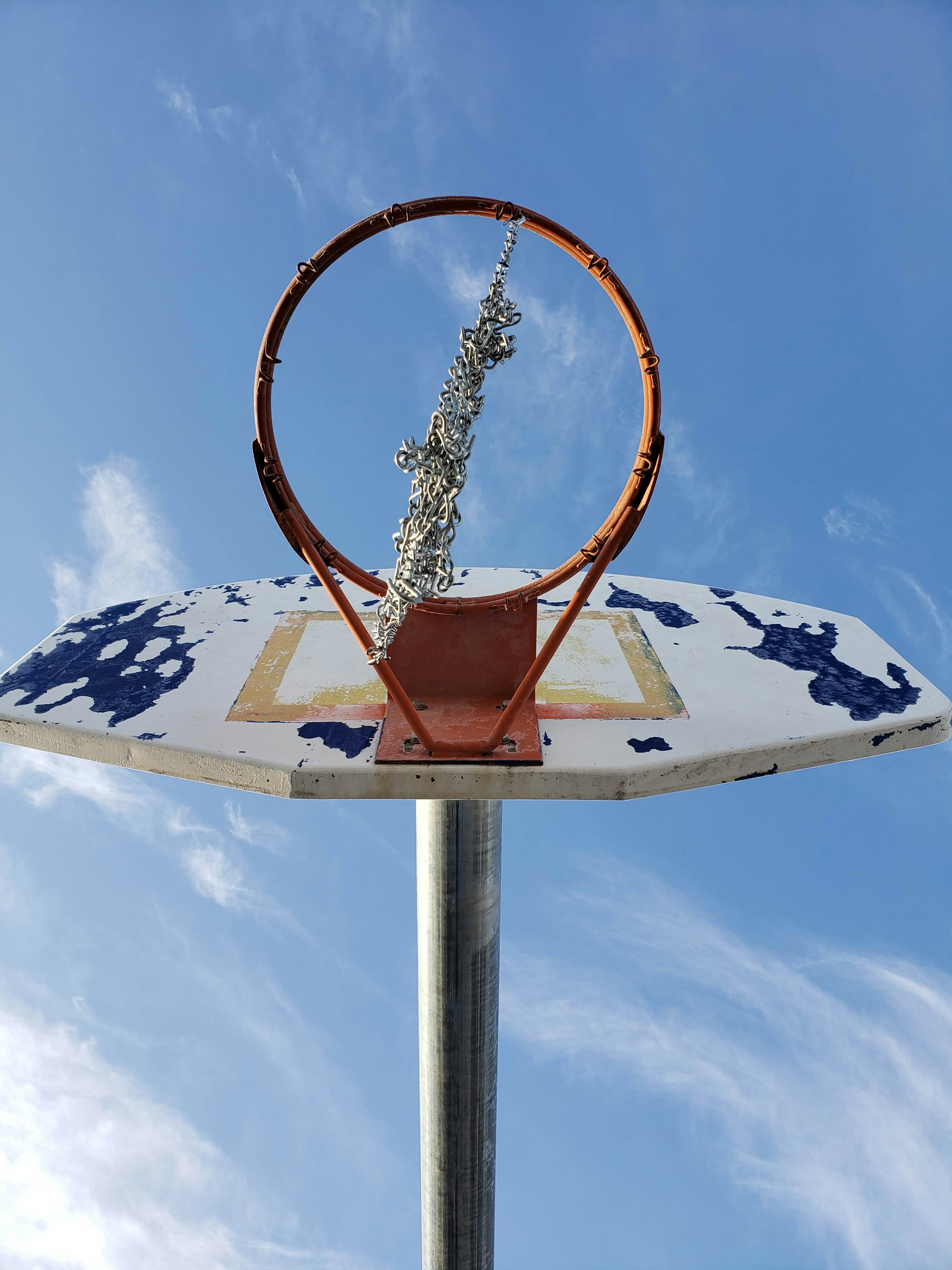 low-angle photography of white basketball rim