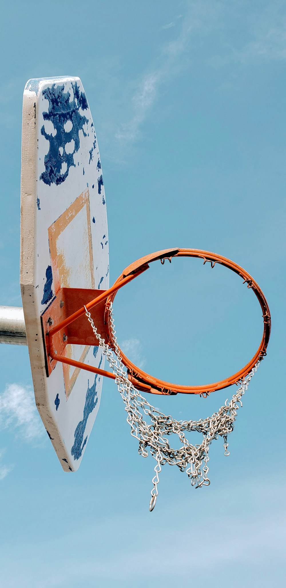 white and blue portable hoop under blue sky