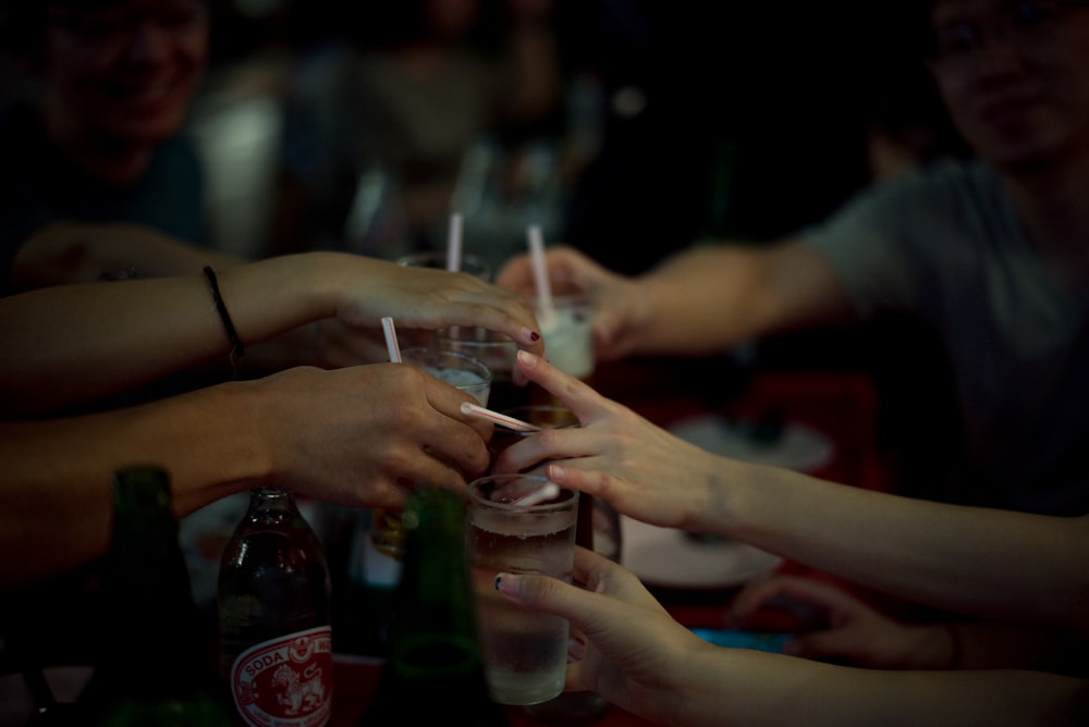 a group of people sitting at a table with drinks