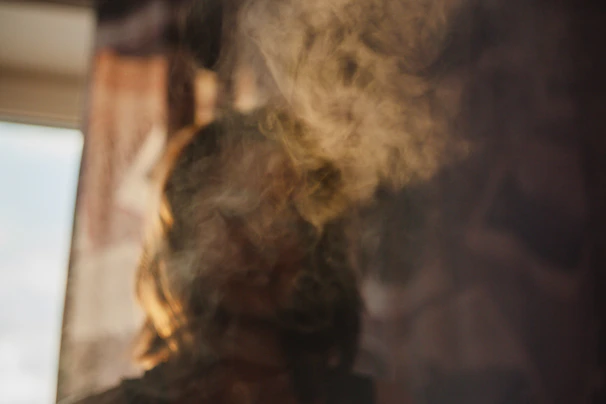 A woman hugging someone who is fading into smoke, set against a heavy emotional dark background with a cinematic premium art style expressing abandonment.