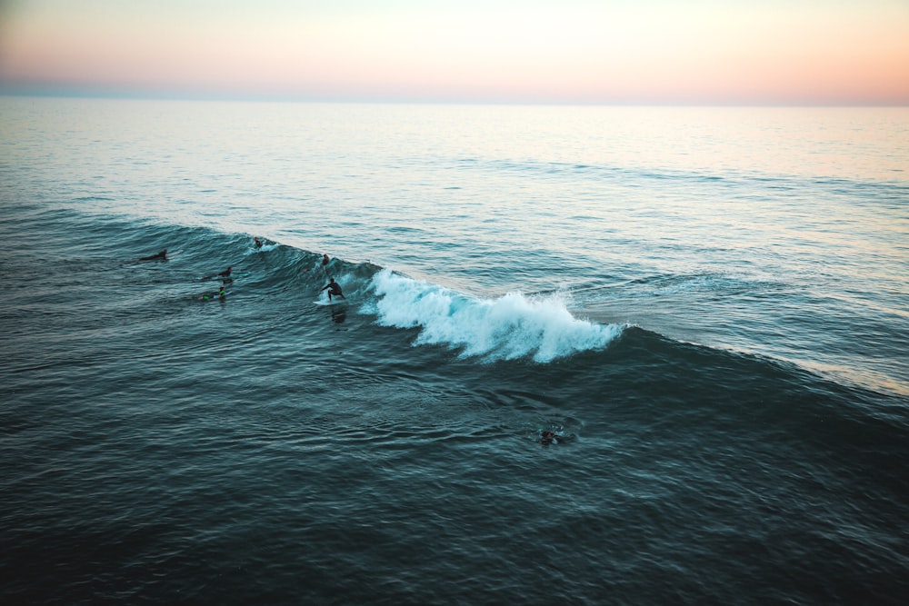 man surfing on wave