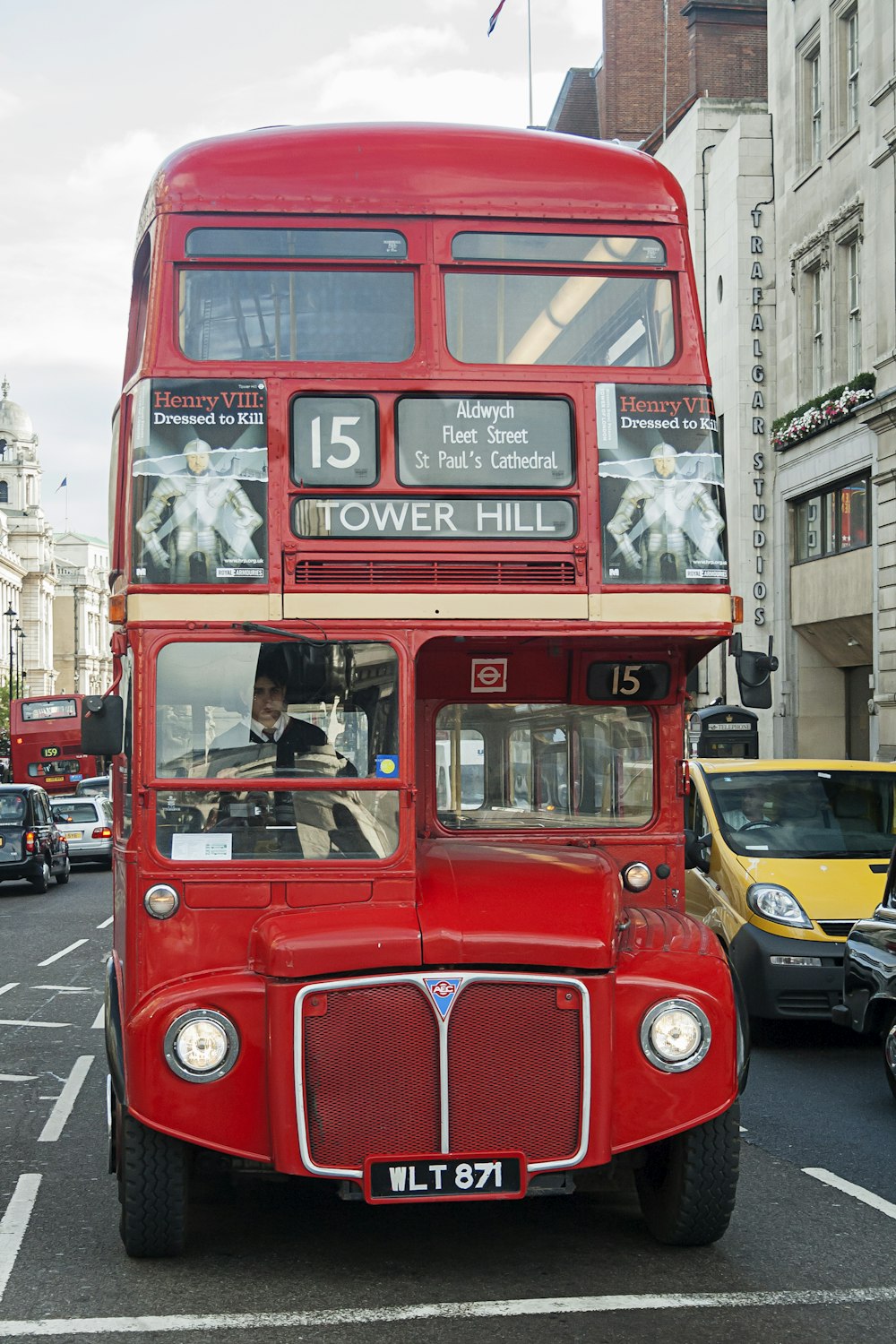 red double-deck bus on street during daytime