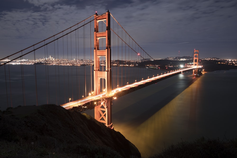 brown suspension bridge at night