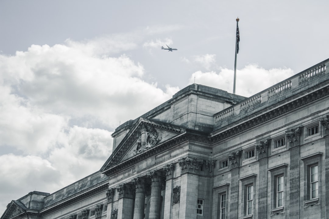 grayscale photography of building under sky