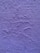 A textured wall painted in a shade of purple. The surface exhibits irregular patterns and roughness characteristic of a plastered finish.
