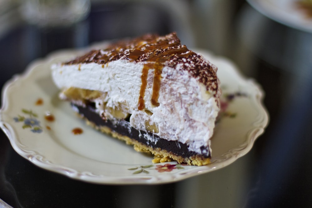 selective focus photography of slice of cake on white plate