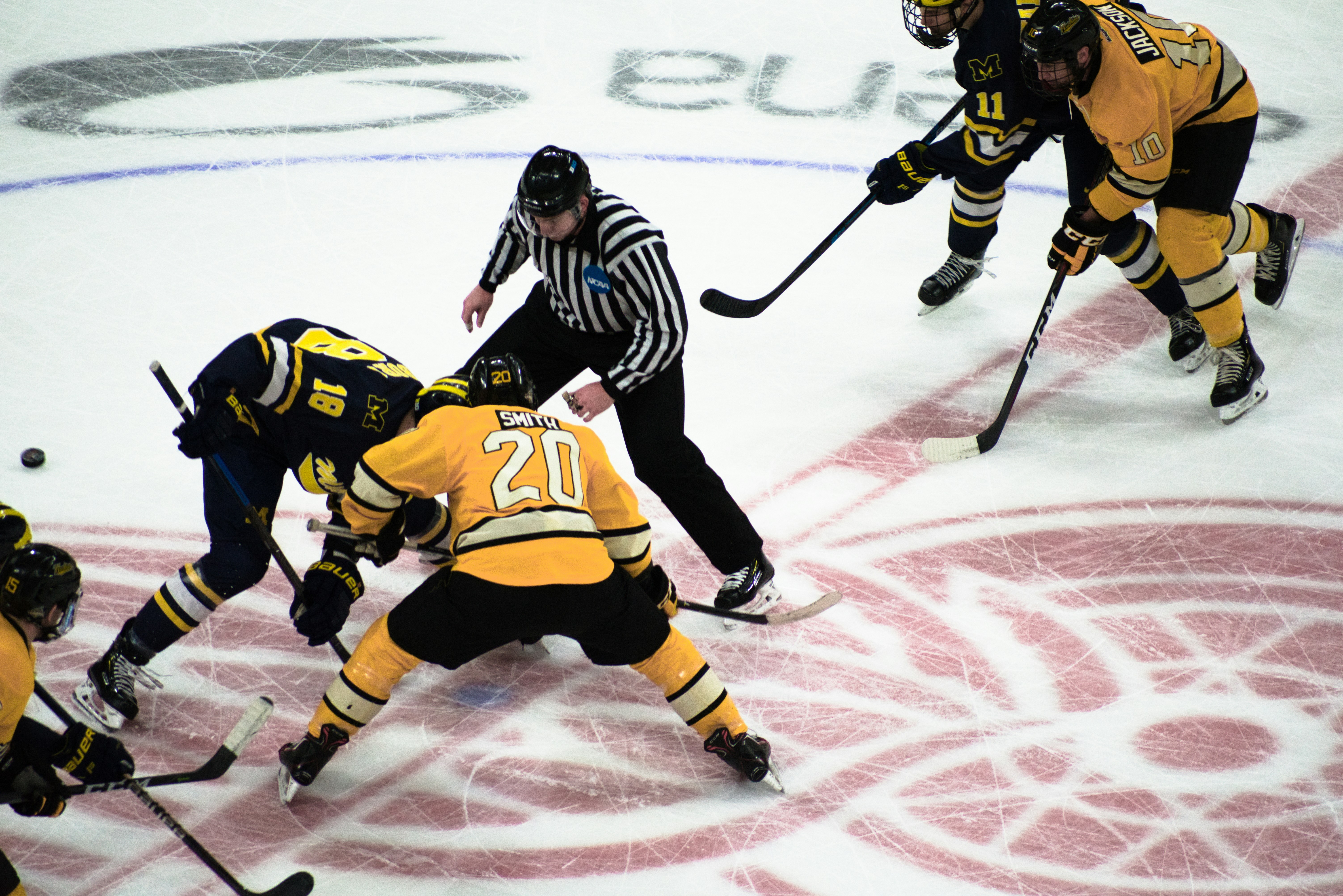 Picture of a face off at an NCAA Hockey game