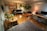 A cozy and modern studio apartment with stylish furnishings and warm lighting.