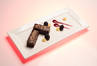 A variety of healthy, sugar-free dessert bars displayed on a ceramic plate.