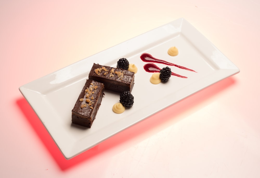 rectangular white ceramic plate with cakes