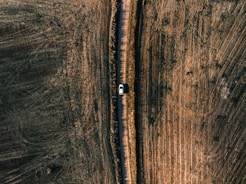 white vehicle on road in aerial photography