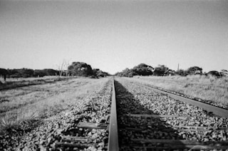 grayscale photo of train railway