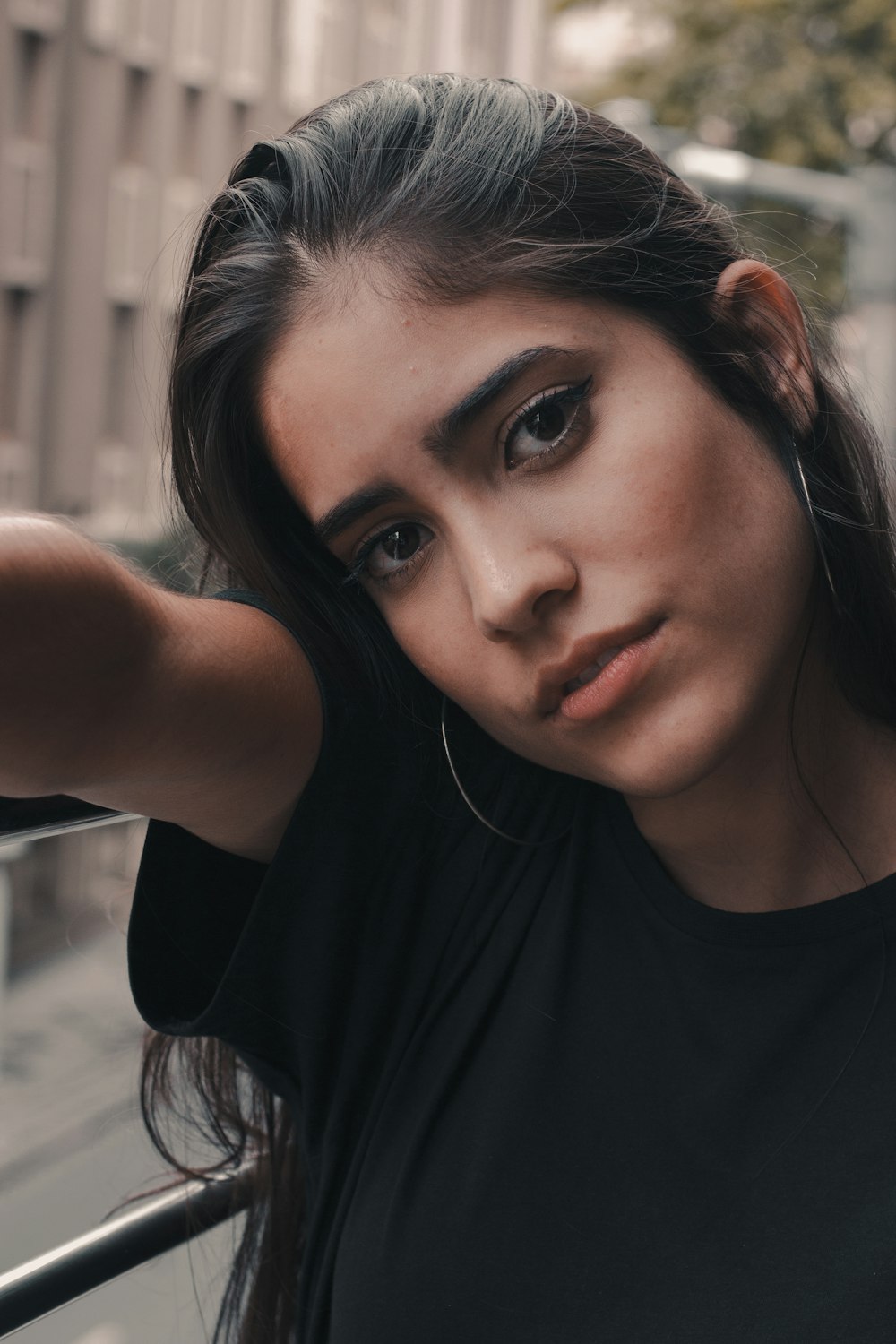 woman wearing black crew-neck t-shirt looking straight