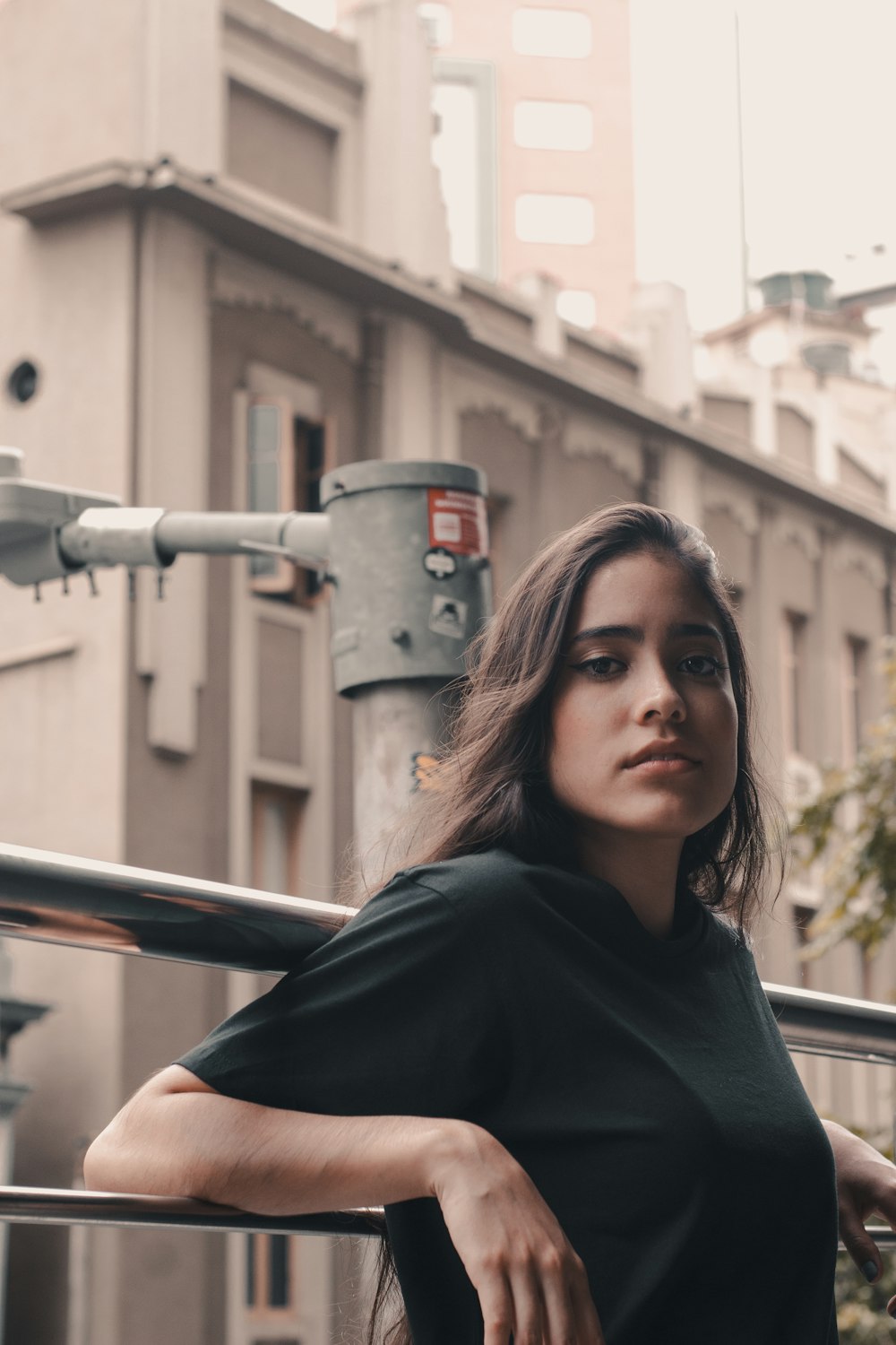 woman leaning on railing