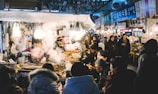 Delicious food being served at a bustling outdoor food stall.