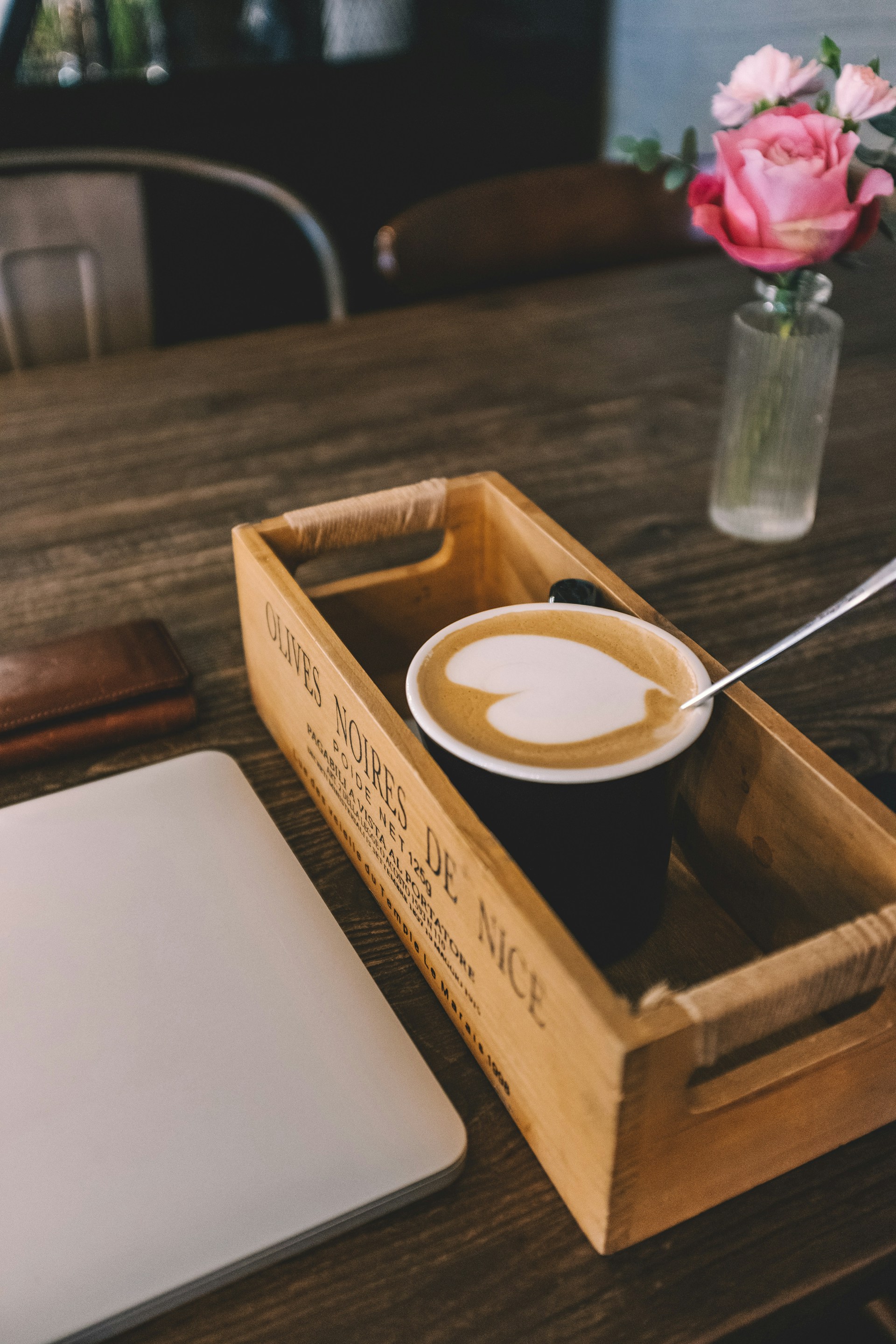 white and black ceramic coffee cup