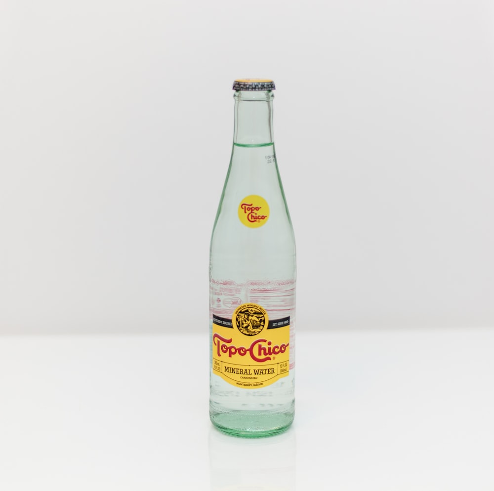 Topo Chico bottle on white surface