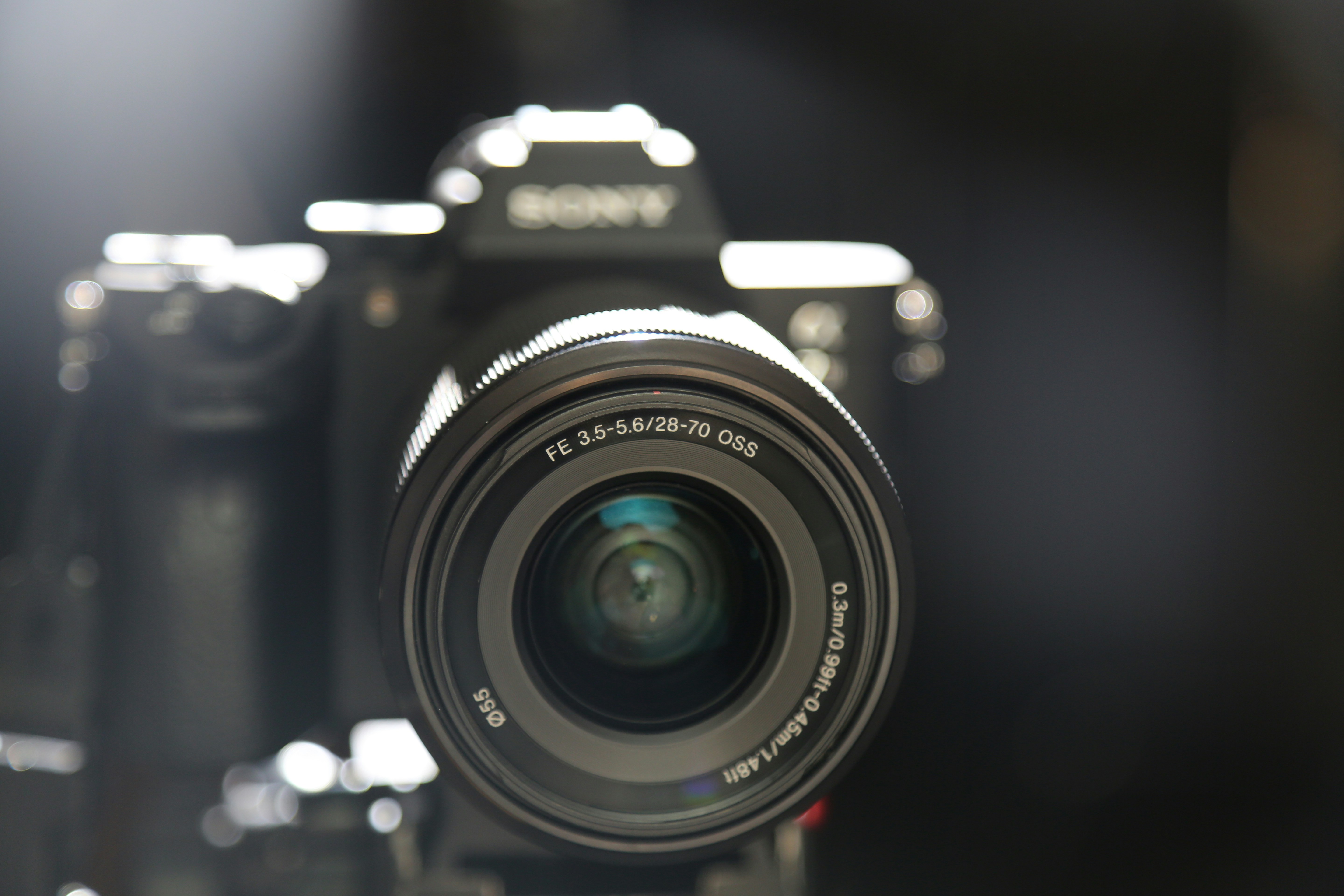 professional mirrorless camera with cinematic cinema lens on studio tripod