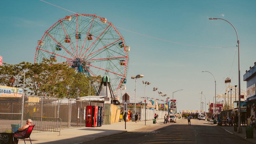 ferris wheel beside green tree