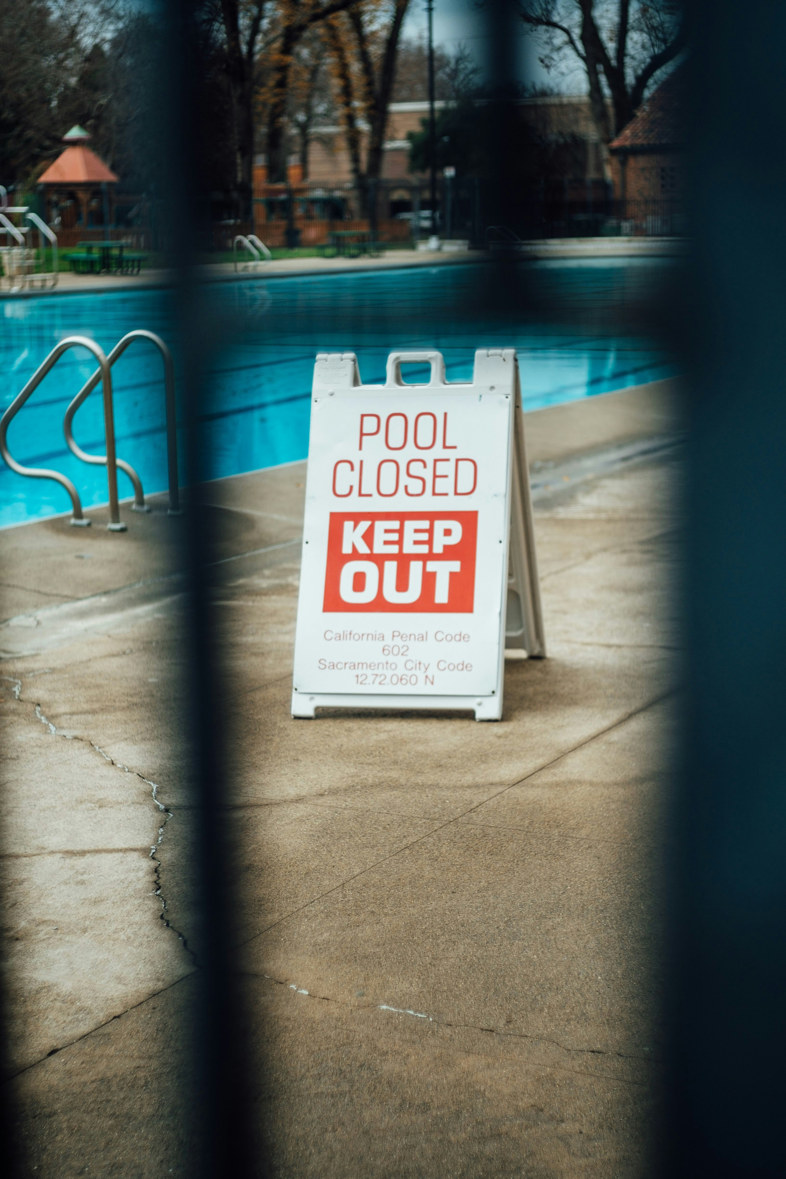 Pool closed keep out signage near pool