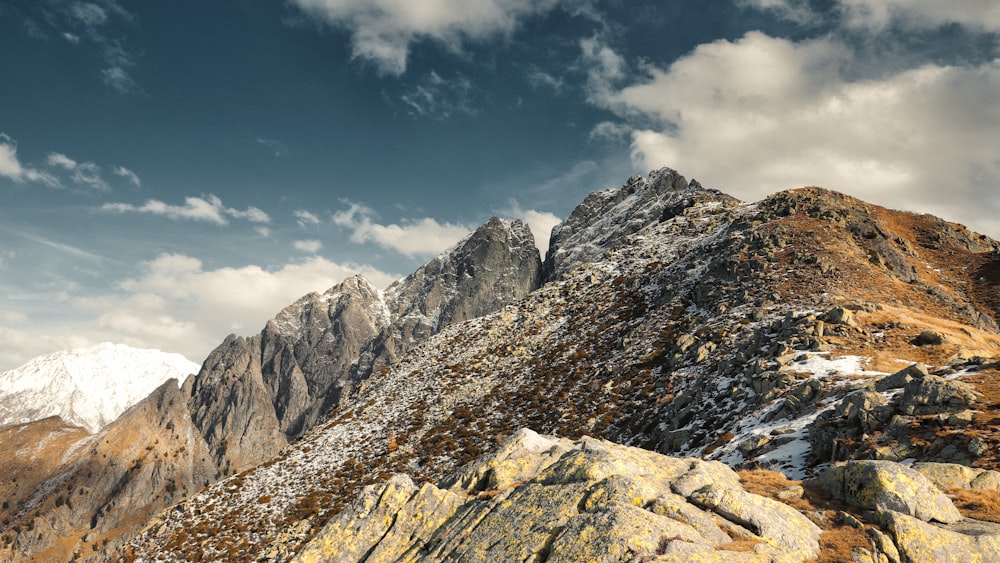 mountain under white skies during daytime