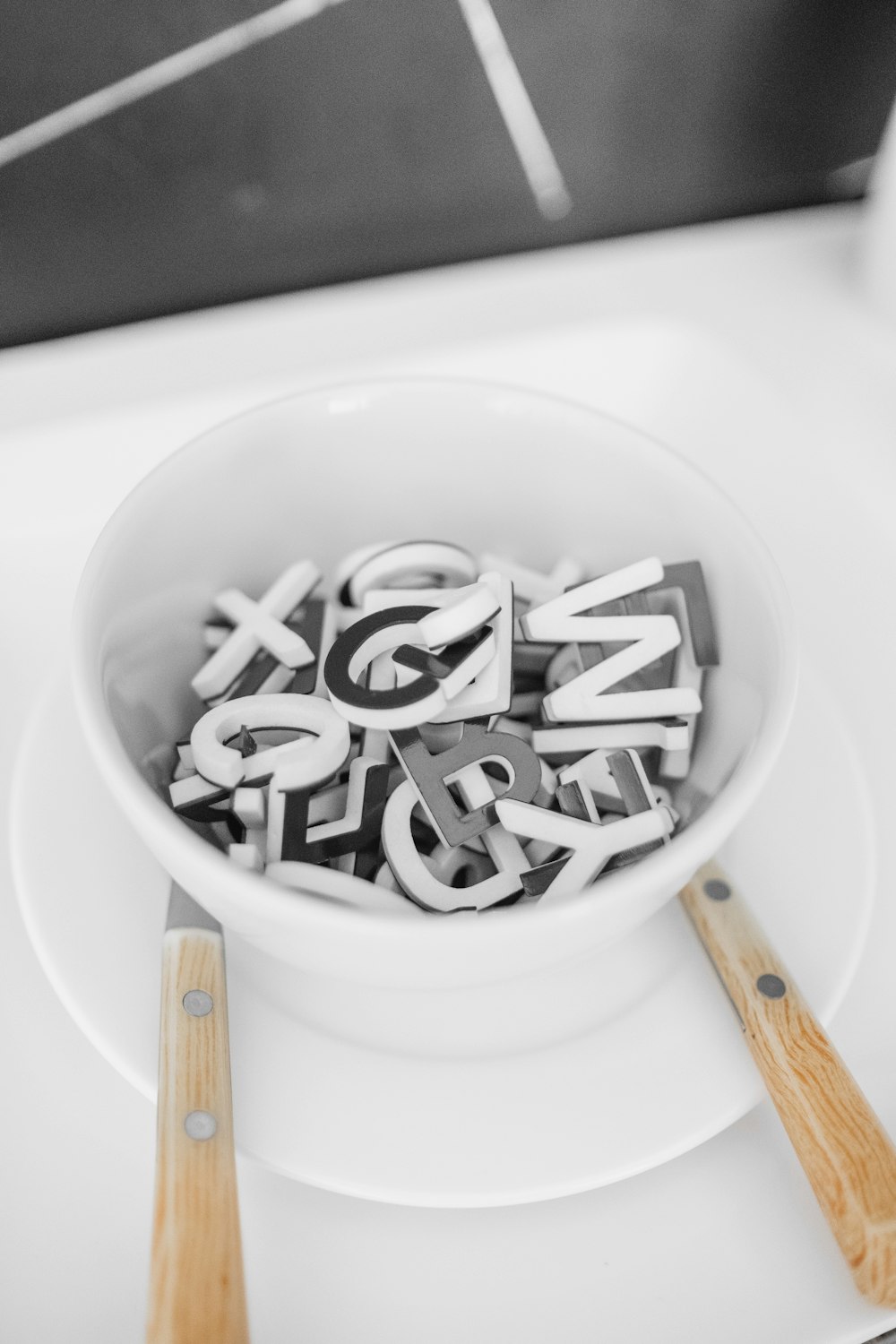 white ceramic bowl on white ceramic plate