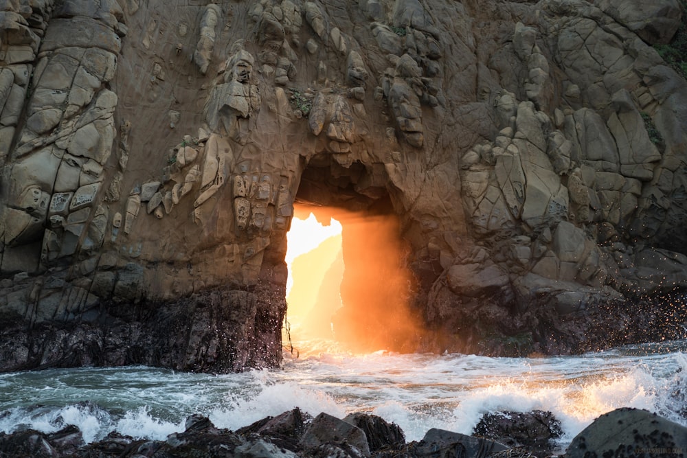 waves crashing rocks during daytime