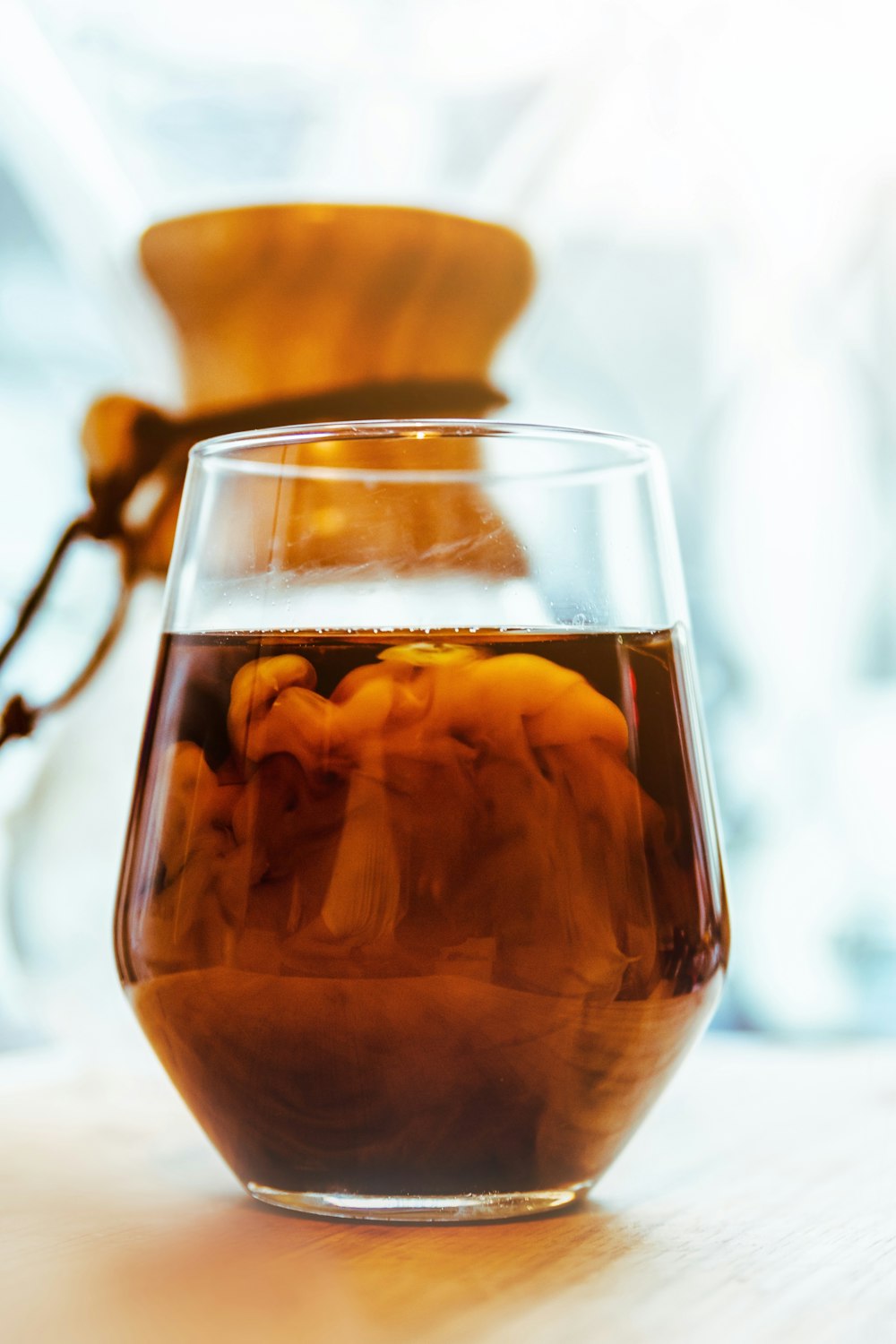 clear glass cup on brown wooden surface