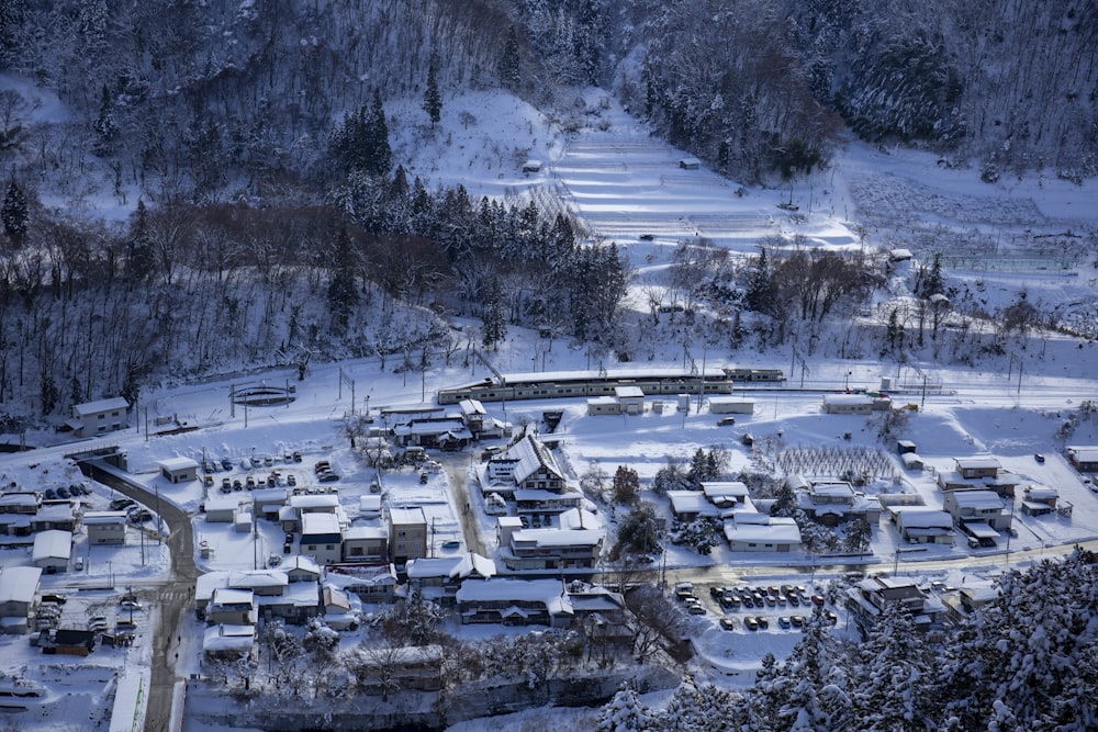 aerial photography of houses near train railway during daytime