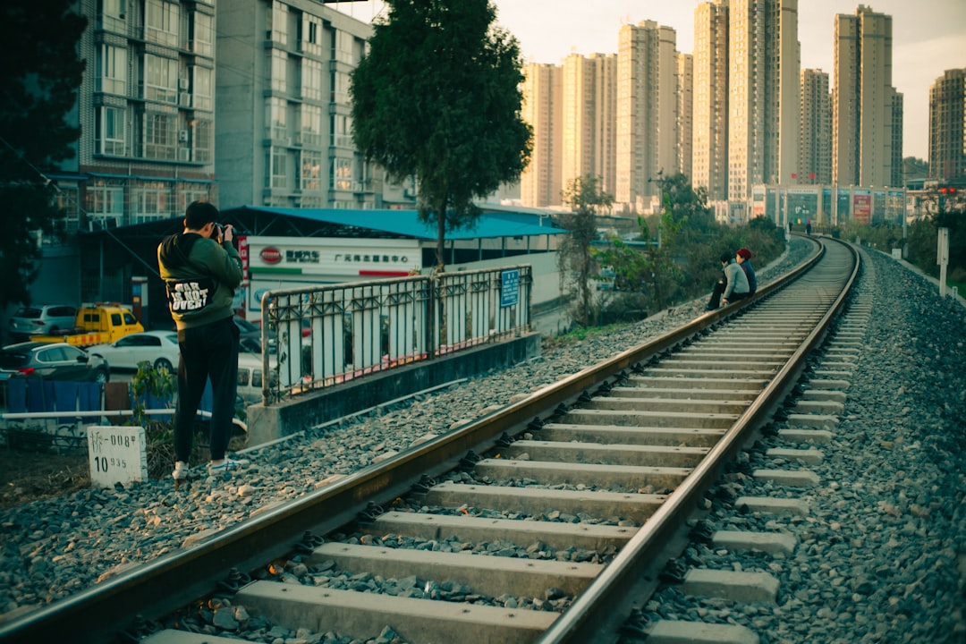 man beside railway