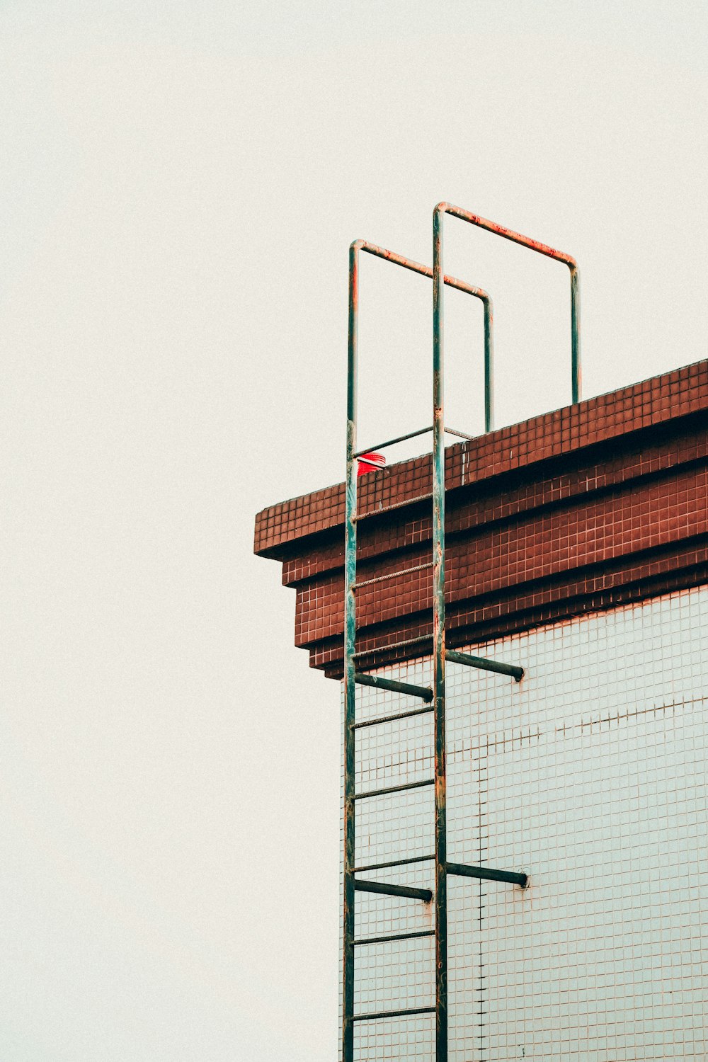 gray metal building emergency exit stair during daytime