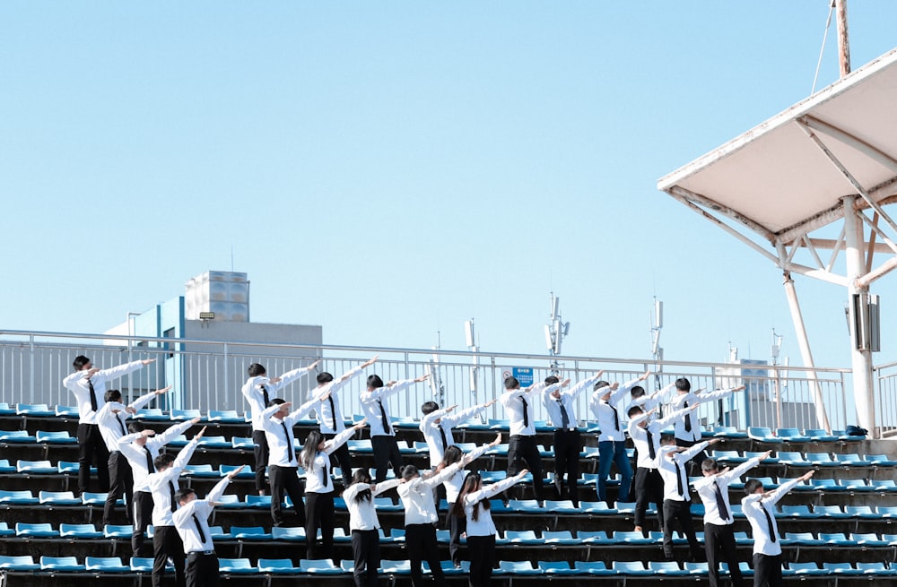 group of students standing on bleachers