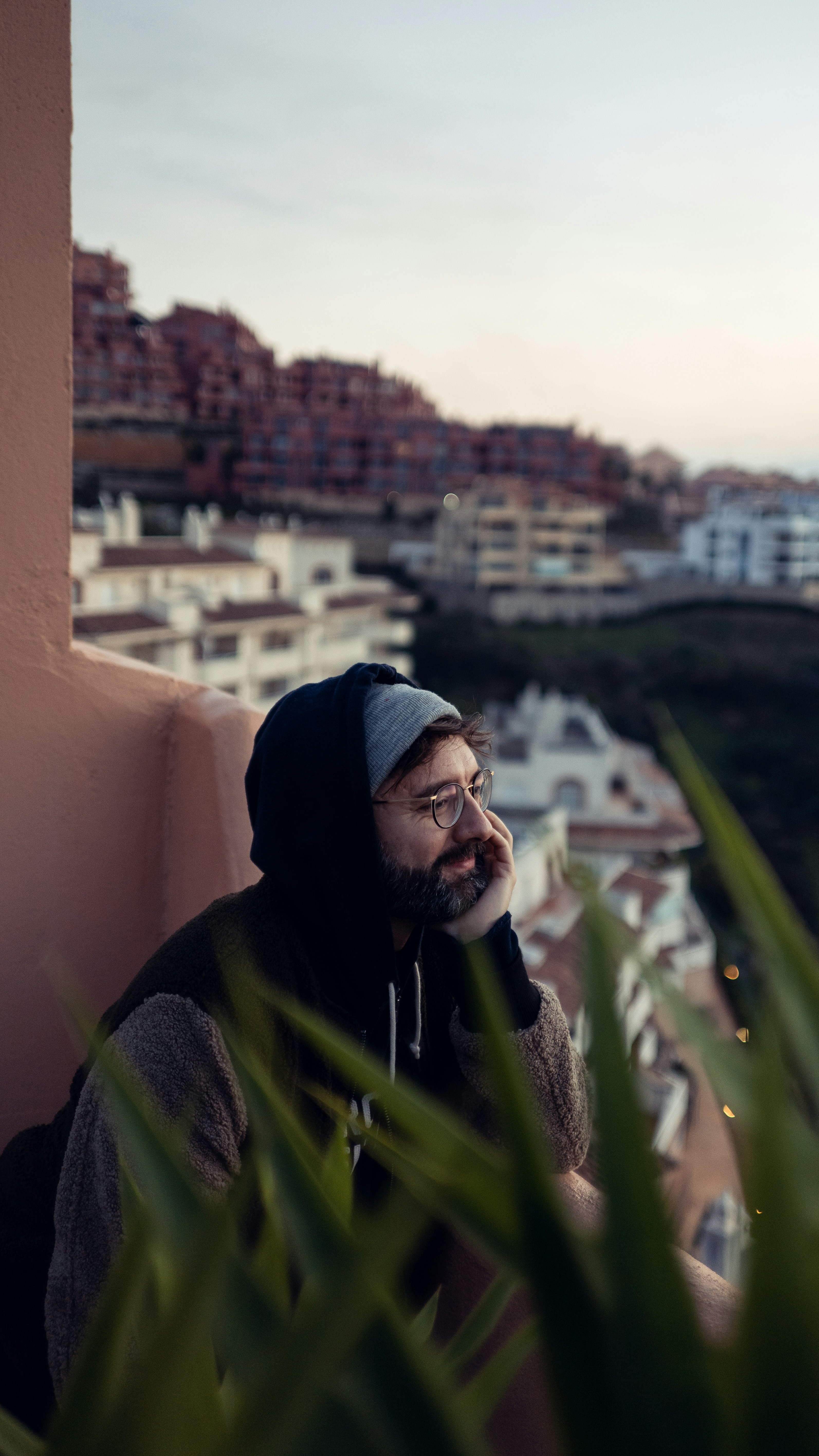 person wearing black pull-over hoodie jacket