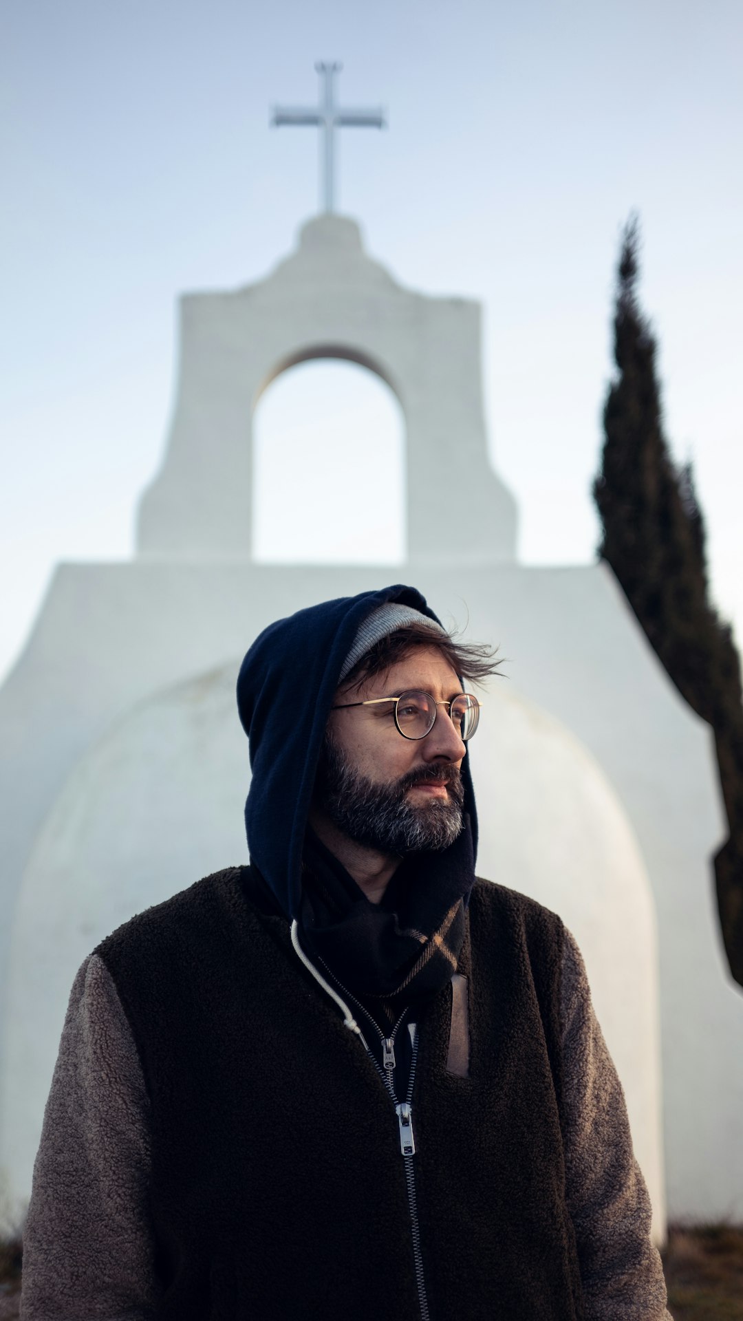 man standing near church