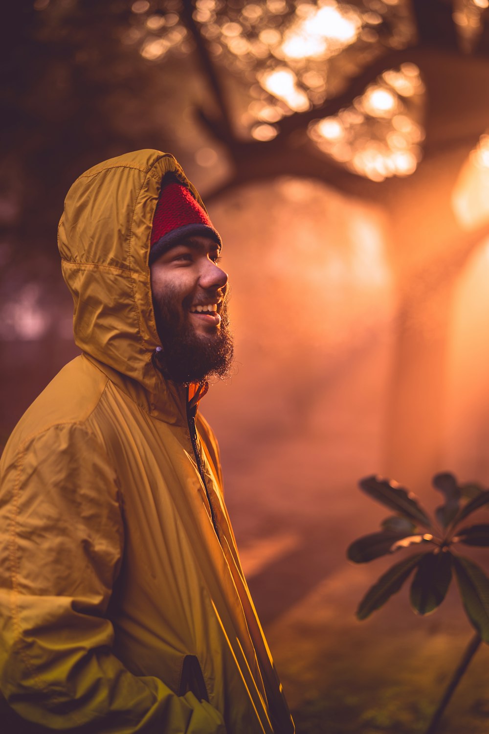 shallow focus photo of man in yellow hoodie