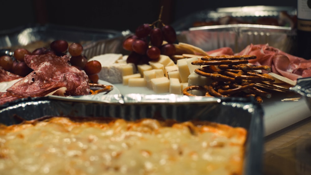 pretzels beside cheese on plate