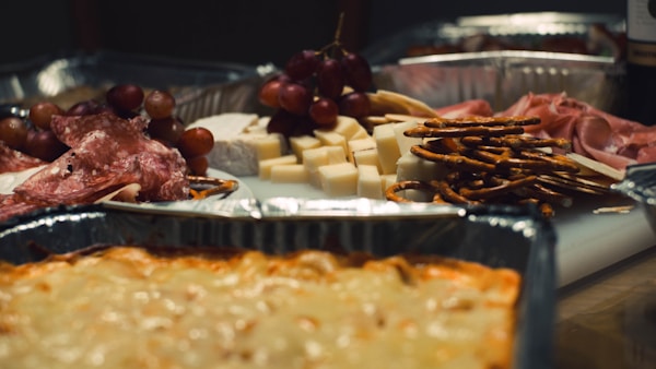 Pretzels beside cheese on plate